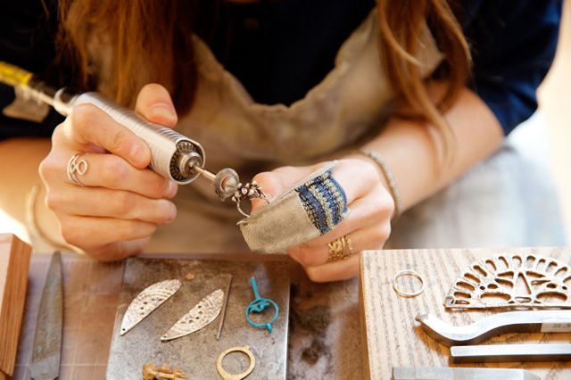 A person making jewelry