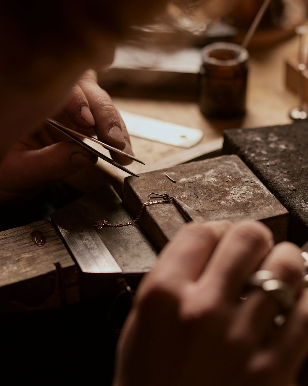 A person making jewelry